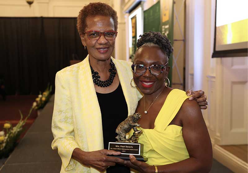 Marie Brown B.A. 92 (R) Presents The Distinguished Black Alumni Award to Pearlie Beverly (L)