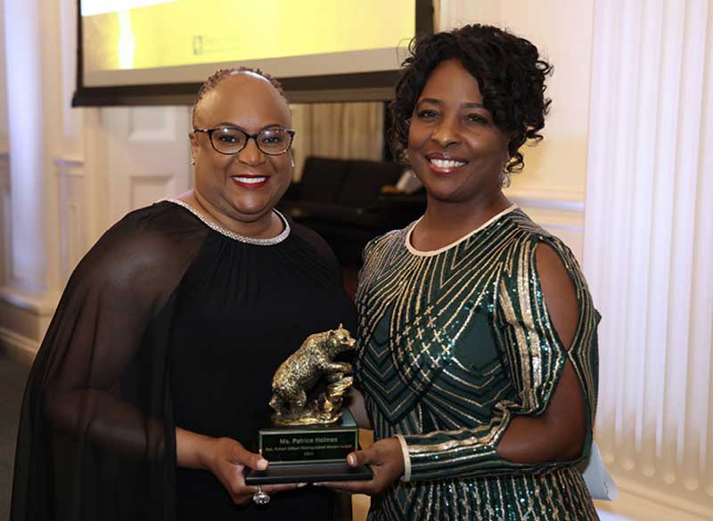 Sandra Silmon B.A. 95 (R) Presents The Distinguished Black Alumni Award To Crystal Woods B.S. 97 (L) On Behalf of Col. Patrice Holmes B.S. 97