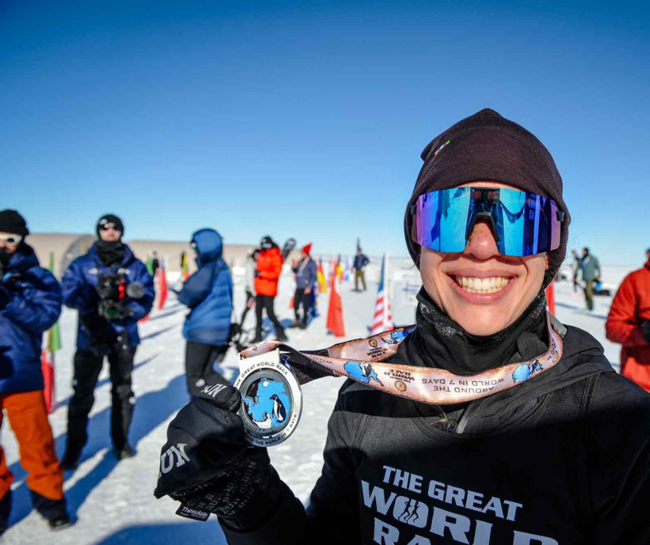 Ashleigh Tran, competing in The Great World Race and wearing a medal
