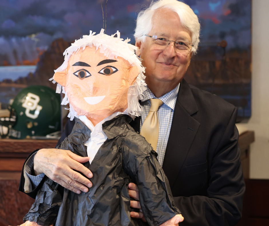 Ed Kinkeade (BA '74, JD '74) with piñata of self