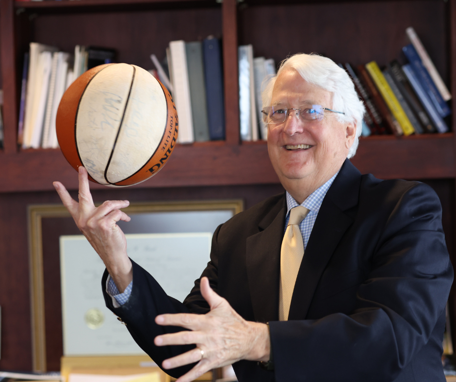 Ed Kinkeade (BA '74, JD '74) spinning basketball