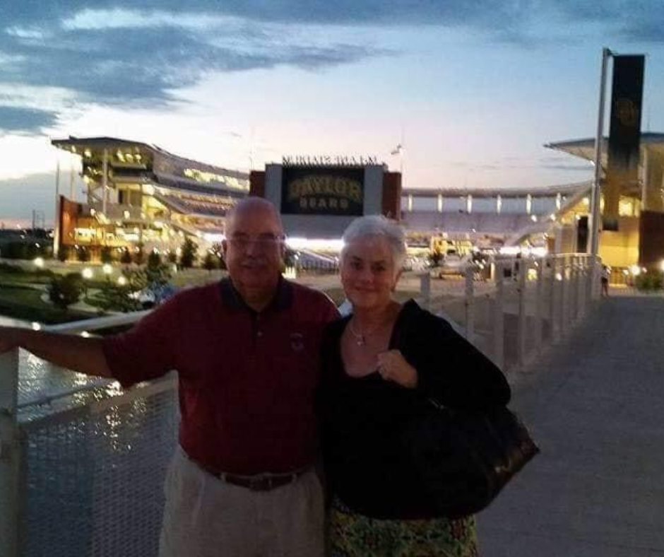 Charles (BS ’70) & Linda (BS ’70) Massler in front of McLane Stadium at Baylor University