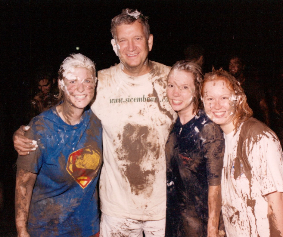 4 people covered in mud and shaving cream, seemingly at a fun college event